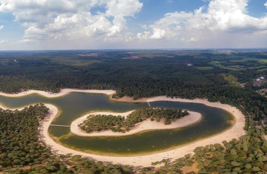 A lake situated in the Netherlands, Utrecht, called Henschotermeer. by drone aerial utrechtse heuvelrug, henschotermeer, lake in holland. Europe