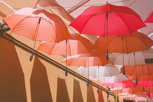 Beautiful hanging umbrellas, sweet pink for love concept.