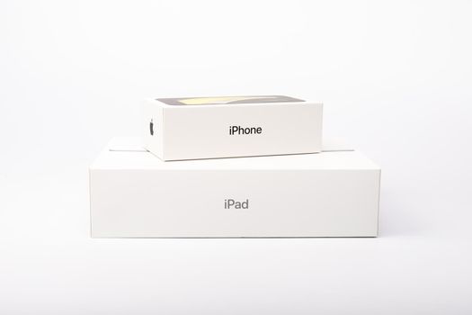 Paris, France - May 14, 2020: packaging of the new black iPhone SE 2020 and iPad from the multinational company Apple during the days of its studio release on a white background