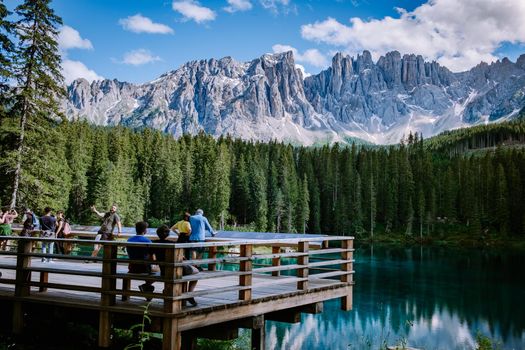 Dolomites Italy, Carezza lake Lago di Carezza July 2020, Karersee with Mount Latemar, Bolzano province, South tyrol, Italy. Landscape of Lake Carezza or Karersee and Dolomites in background, Nova Levante, Bolzano, Italy. Europe