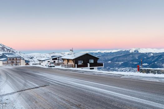 Saint Lary Soulan, France - December 26, 2020: mountain chalet in a snowy ski resort on a winter evening during the holiday season