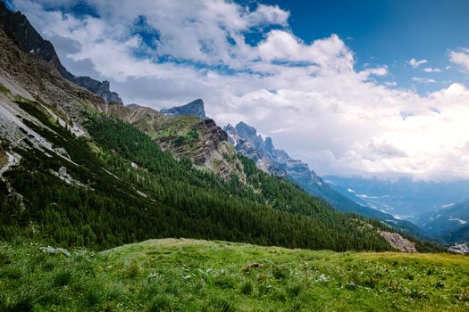 Pale di San Martino from Baita Segantini - Passo Rolle italy,Couple visit the italian Alps, View of Cimon della Pala, the best-know peak of the Pale di San Martino Group in the Dolomites, northern Italy Europe