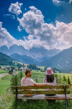 couple on vacation in the Dolomites Italy, Santa Magdalena Village in Dolomites area Italy Europe Val Di Funes