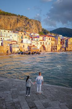 Cefalu, the medieval village of Sicily island, Province of Palermo, Italy. Europe, a couple on vacation at the Italian Island Sicilia