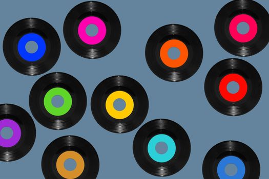 vinyl 45rpm single records on a blue background