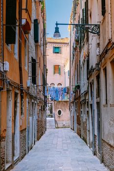 Beautiful venetian street in summer day, Italy. Venice Europe