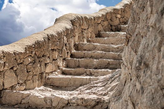 Stone staircase on the rock of the mountain.