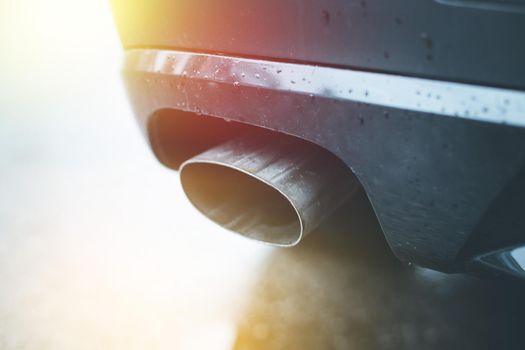Close up of an exhaust pipe of a car, environmental pollution