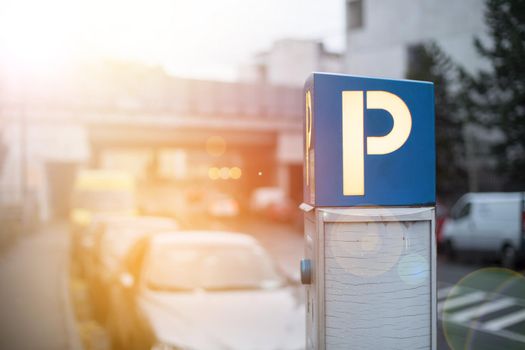 Parking machine in the city street, evening, sunlight.