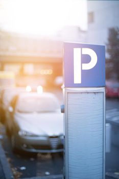 Parking machine in the city street, evening, sunlight.