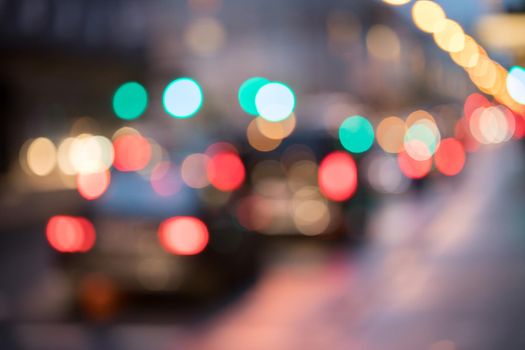 City traffic in the night, blurred with light points
