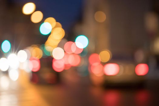 City traffic in the night, blurred with light points