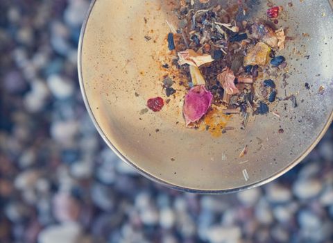 Close up picture of dried incense on a metal bowl