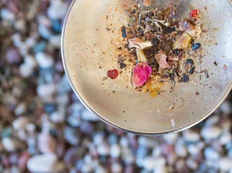 Close up picture of dried incense on a metal bowl