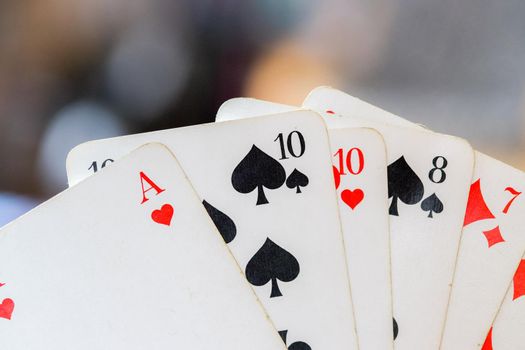 Man is playing cards, cutout of his hands