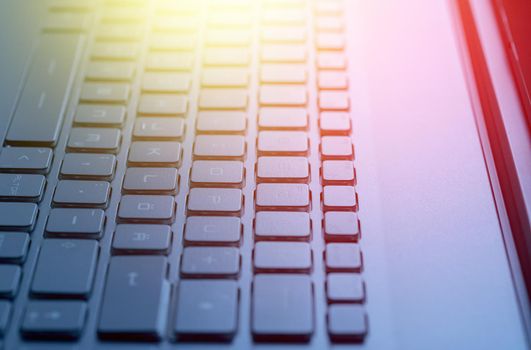Closeup picture of a black laptop keyboard, Sunshine