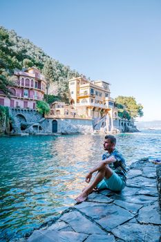 guy on vacation ligurian coast Italy,Portofino famous village bay, Italy Europe colorful village Ligurian coast