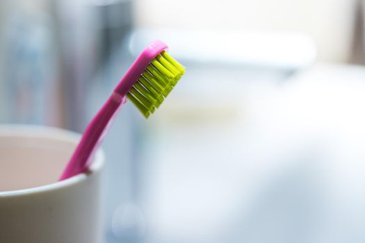 Colorful toothbrush in the bathroom, morning routine