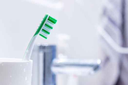 Colorful toothbrush in the bathroom, morning routine