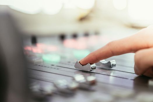 Moderator and soundboard in radio broadcasting studio