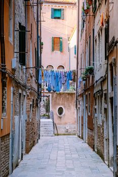 Beautiful venetian street in summer day, Italy. Venice Europe