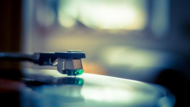 Close up picture of a record player, playing a record