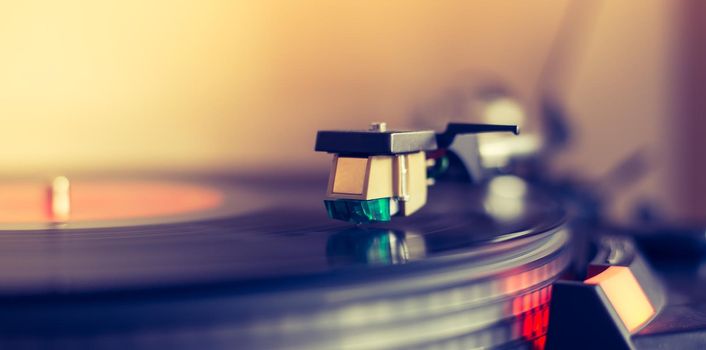 Close up picture of a record player, playing a record