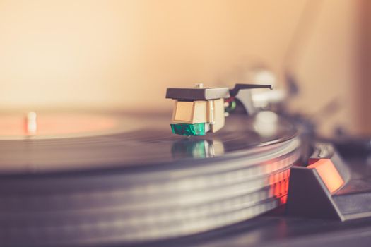 Close up picture of a record player, playing a record