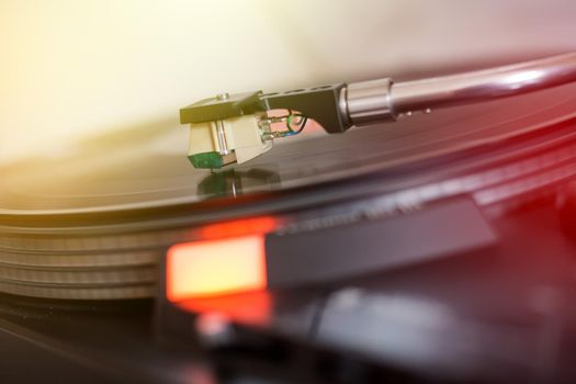 Close up picture of a record player, playing a record