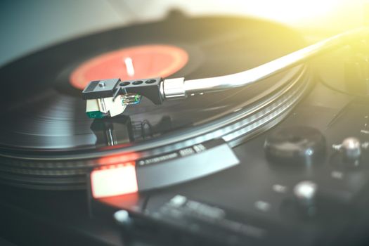 Close up picture of a record player, playing a record