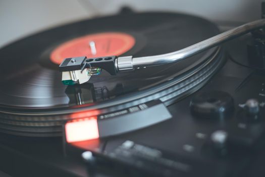 Close up picture of a record player, playing a record