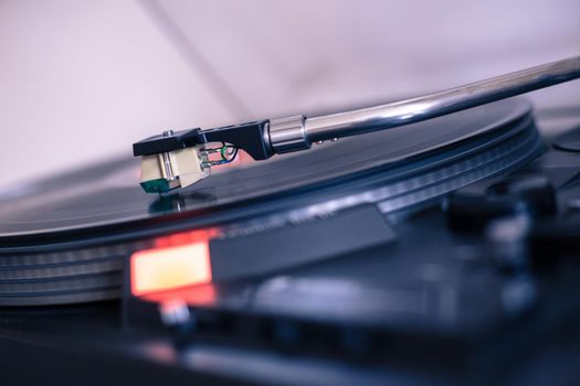 Close up picture of a record player, playing a record
