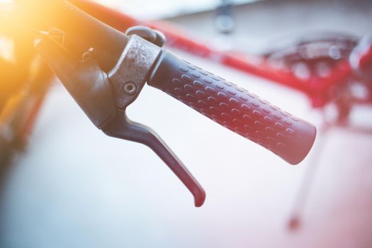 Closeup picture of a bicycle handlebar and breaks, bike repair, blurred background