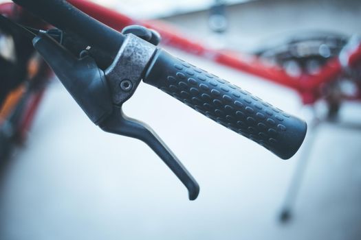 Closeup picture of a bicycle handlebar and breaks, bike repair, blurred background