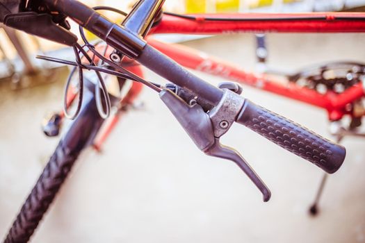 Closeup picture of a bicycle handlebar and breaks, bike repair, blurred background