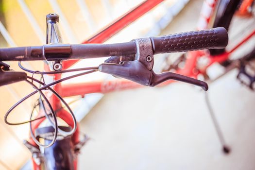 Closeup picture of a bicycle handlebar and breaks, bike repair, blurred background