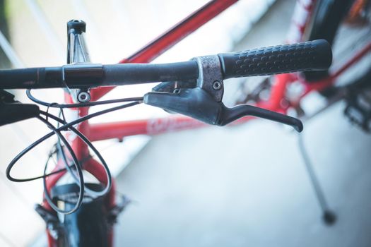 Closeup picture of a bicycle handlebar and breaks, bike repair, blurred background