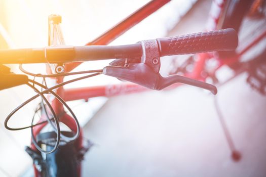 Closeup picture of a bicycle handlebar and breaks, bike repair, blurred background