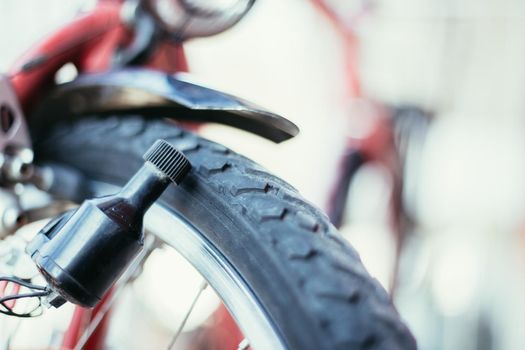 Close up picture of a bike dynamo, blurry background