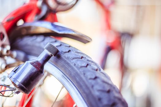 Close up picture of a bike dynamo, blurry background