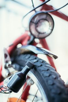 Close up picture of a bike dynamo, blurry background