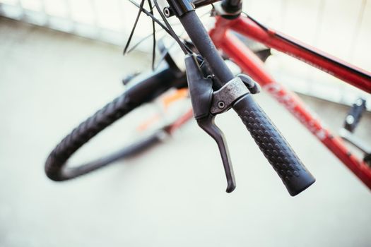 Closeup picture of a bicycle handlebar and breaks, bike repair, blurred background