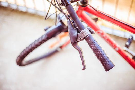 Closeup picture of a bicycle handlebar and breaks, bike repair, blurred background