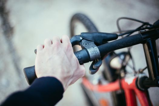 Closeup picture of a bicycle handlebar and breaks, bike repair, blurred background