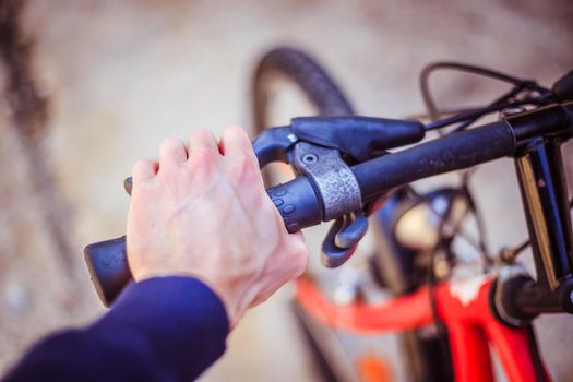 Closeup picture of a bicycle handlebar and breaks, bike repair, blurred background