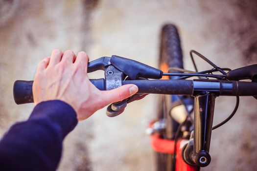 Closeup picture of a bicycle handlebar and breaks, bike repair, blurred background