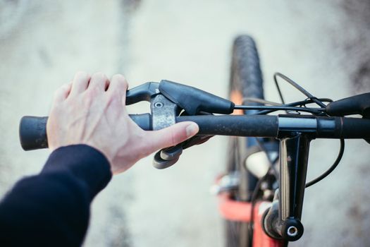 Closeup picture of a bicycle handlebar and breaks, bike repair, blurred background