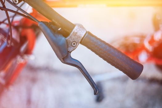 Closeup picture of a bicycle handlebar and breaks, bike repair, blurred background