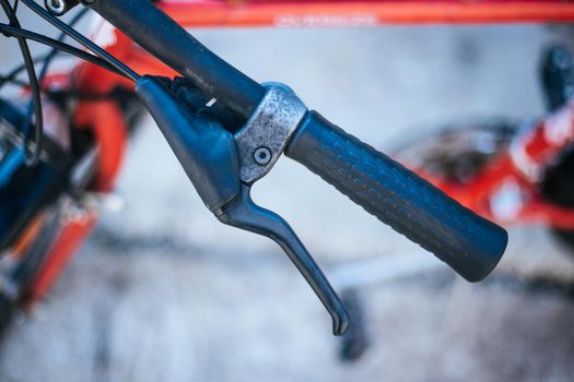 Closeup picture of a bicycle handlebar and breaks, bike repair, blurred background