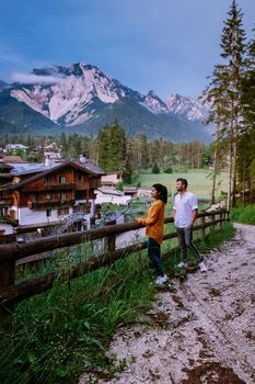 couple on vacation in the, Dolomites Italy, small church during cloudy foggy weather, San Vigilio di Marebbe,South Tirol,Italy San Vigilio di Marebbe small town in Dolomites mountain Europe